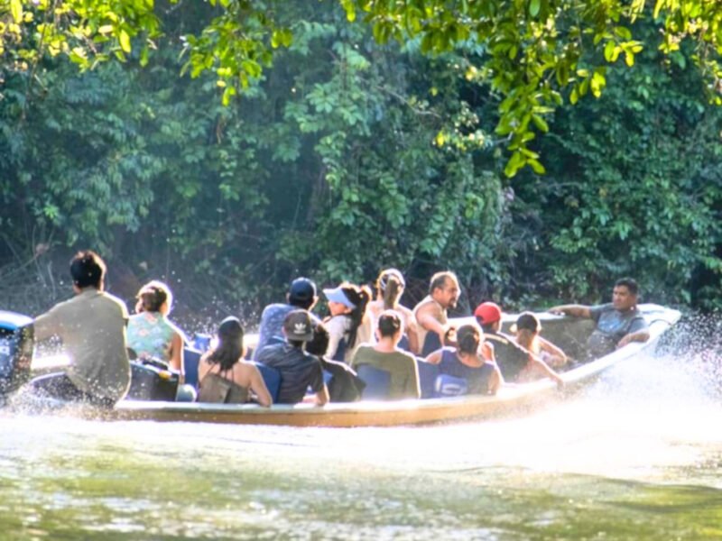 Motorized canoe arriving through the jungle waterways of Cuyabeno