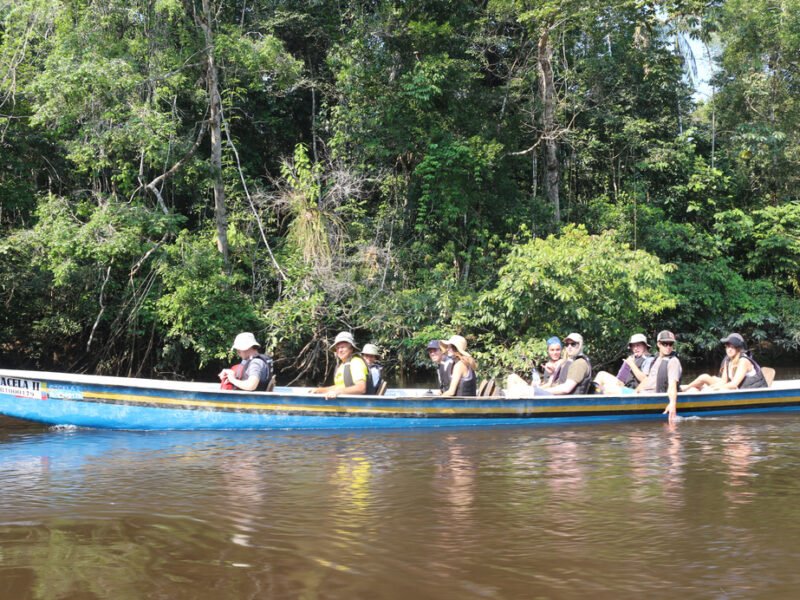 Paddling a traditional canoe in the Cuyabeno Wildlife Reserve